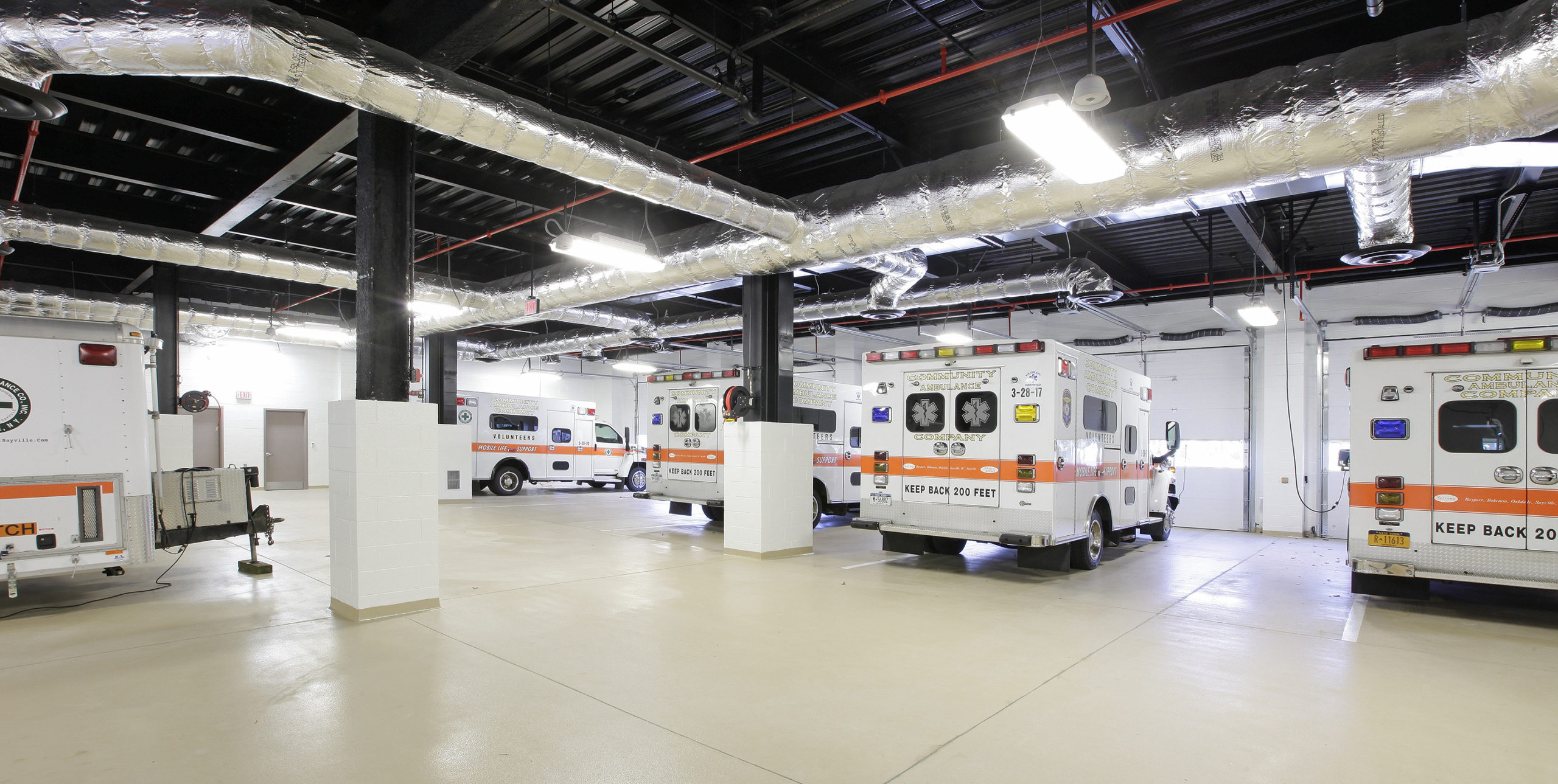 five ambulances inside Community Ambulance of Sayville