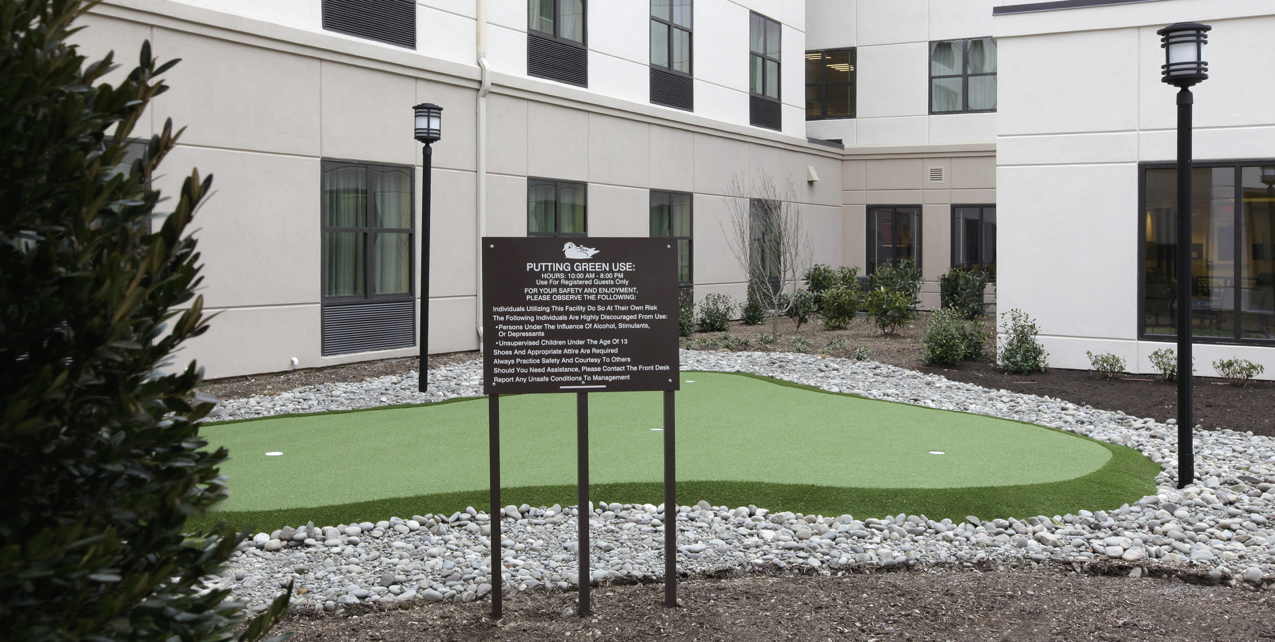 Exterior putting green of Homewood Suites in Carle Place
