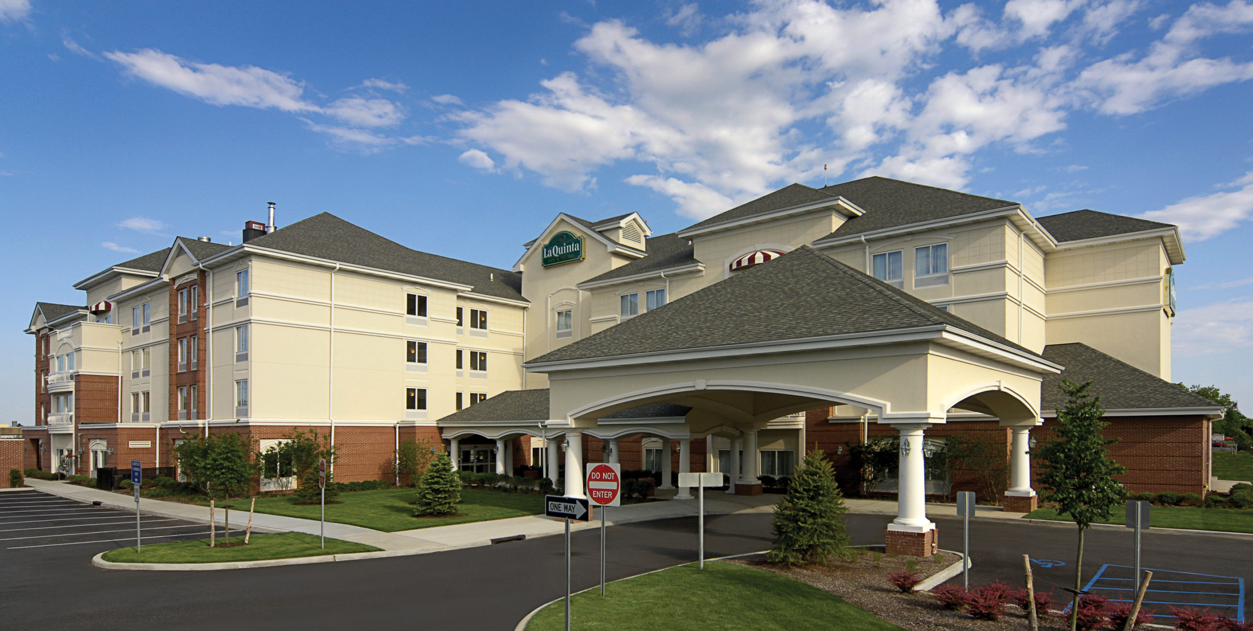 Front entrance to La Quinta Inn and Suites by Wyndham Islip at 10 Aero Road, Bohemia