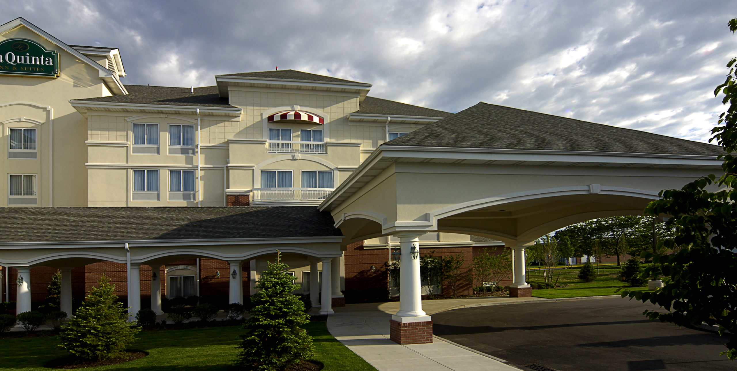 Front entrance to La Quinta Inn and Suites by Wyndham Islip at 10 Aero Road, Bohemia