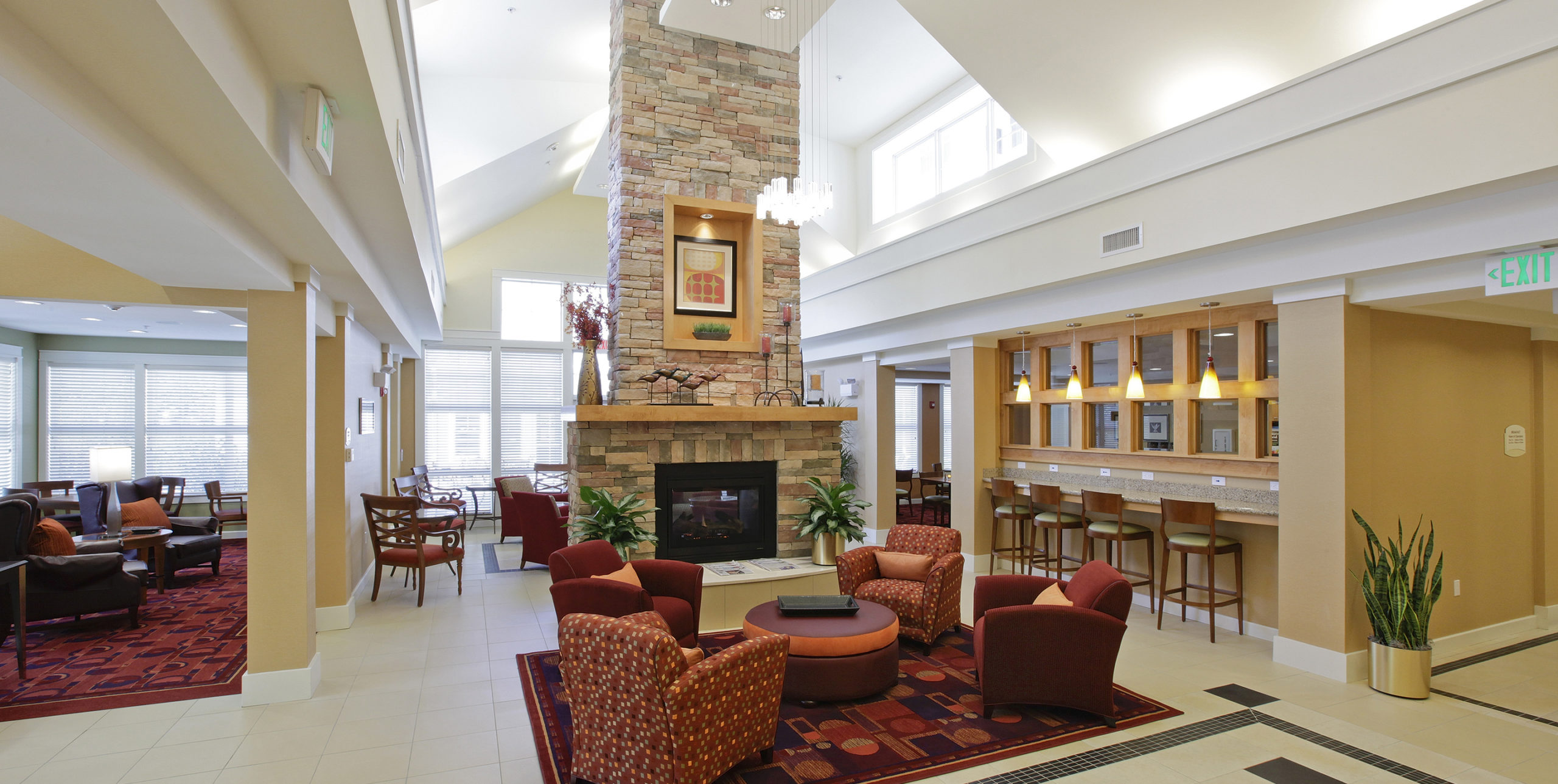 Lobby seating in front of a fireplace at Residence Inn by Marriott in Yonkers