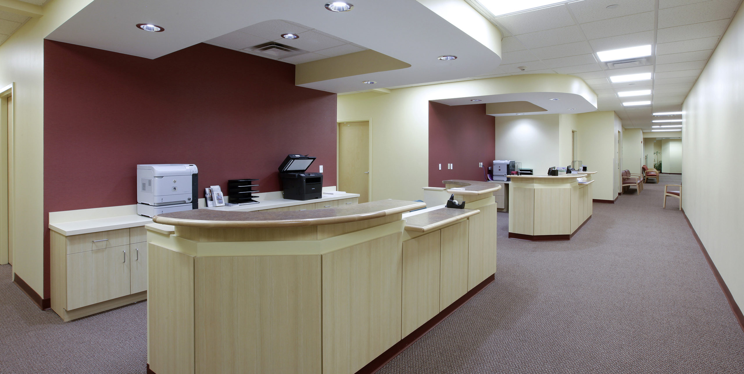 Two receptionist desks at Orthopedic Associates of Long Island in East Setauket
