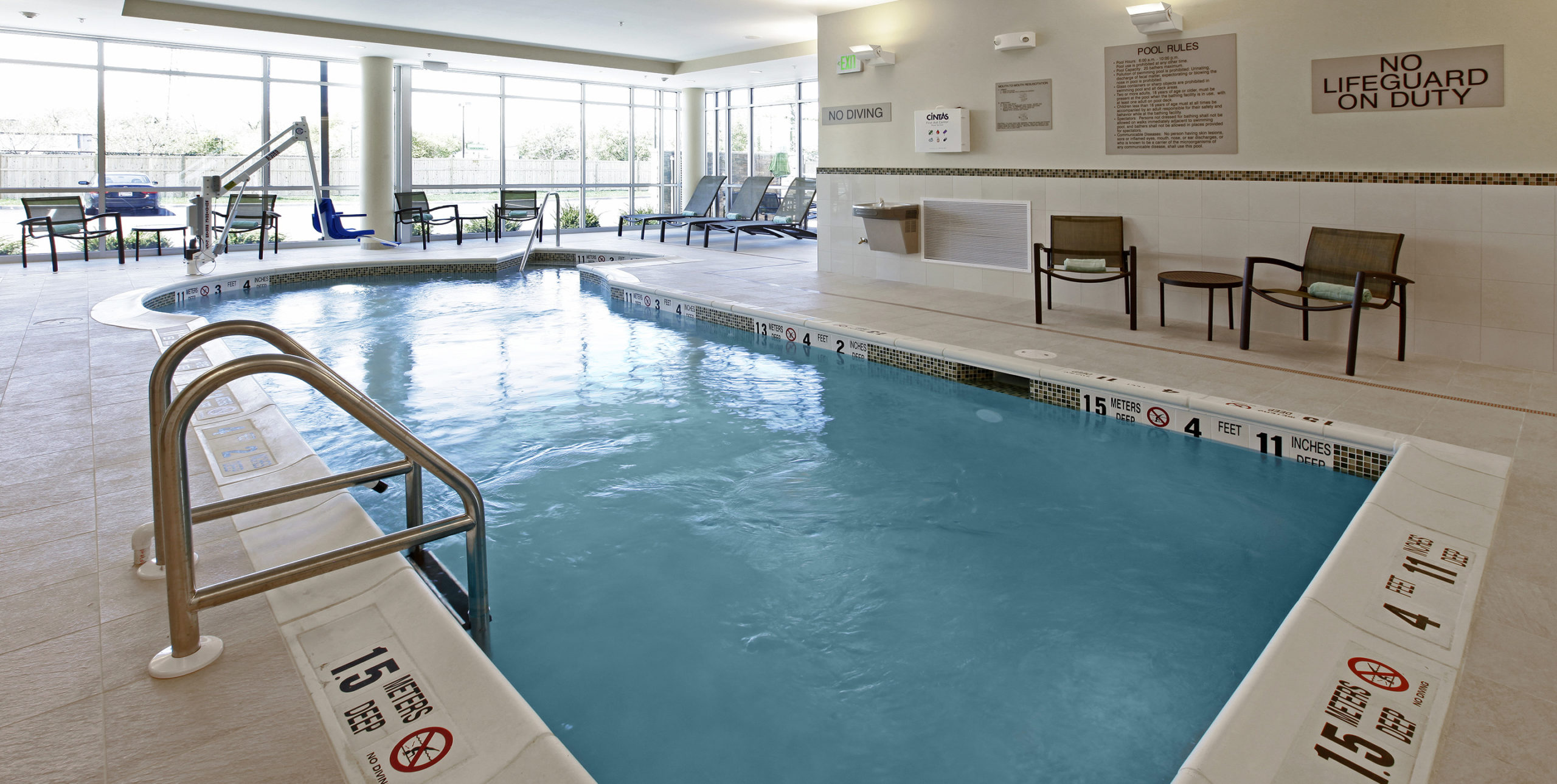 Indoor pool deck at Spring Hill Suites by Marriott in Carle Place