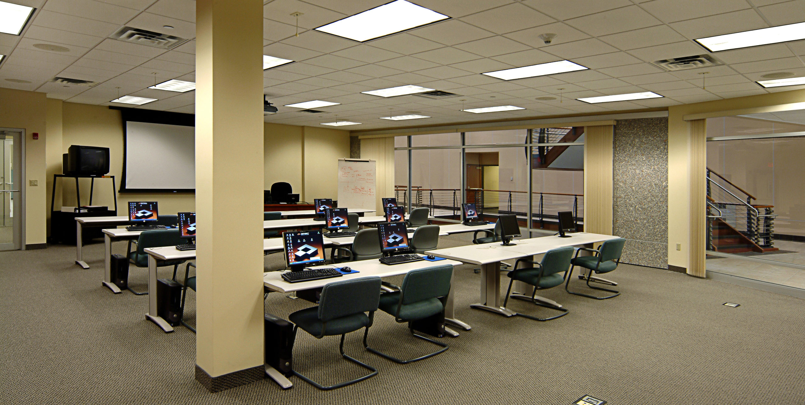 SMSC training room with tables, chairs, and computers in Hauppauge