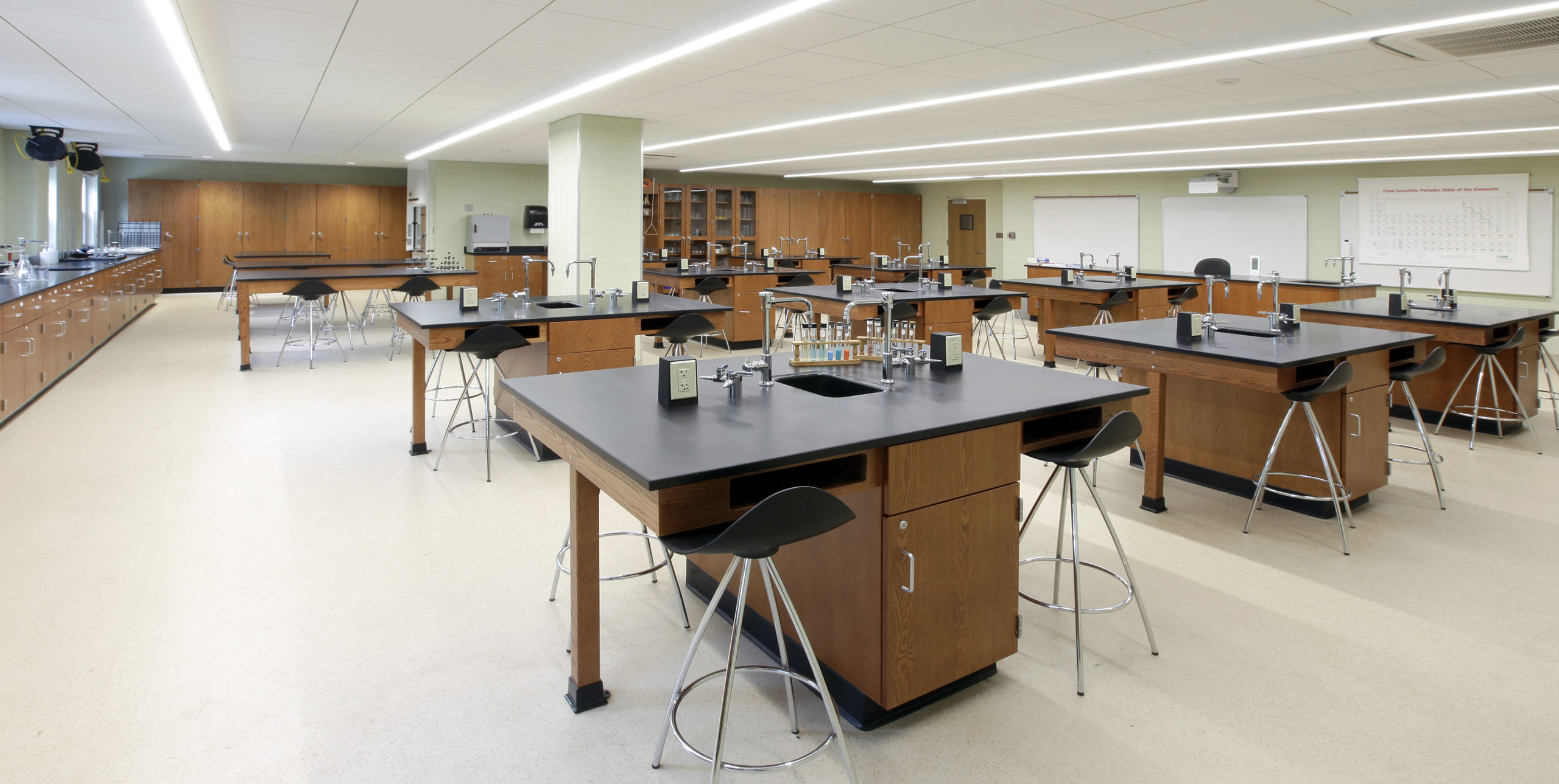 Chemistry lab with two stools at each lab table at Saint Anthony's High School
