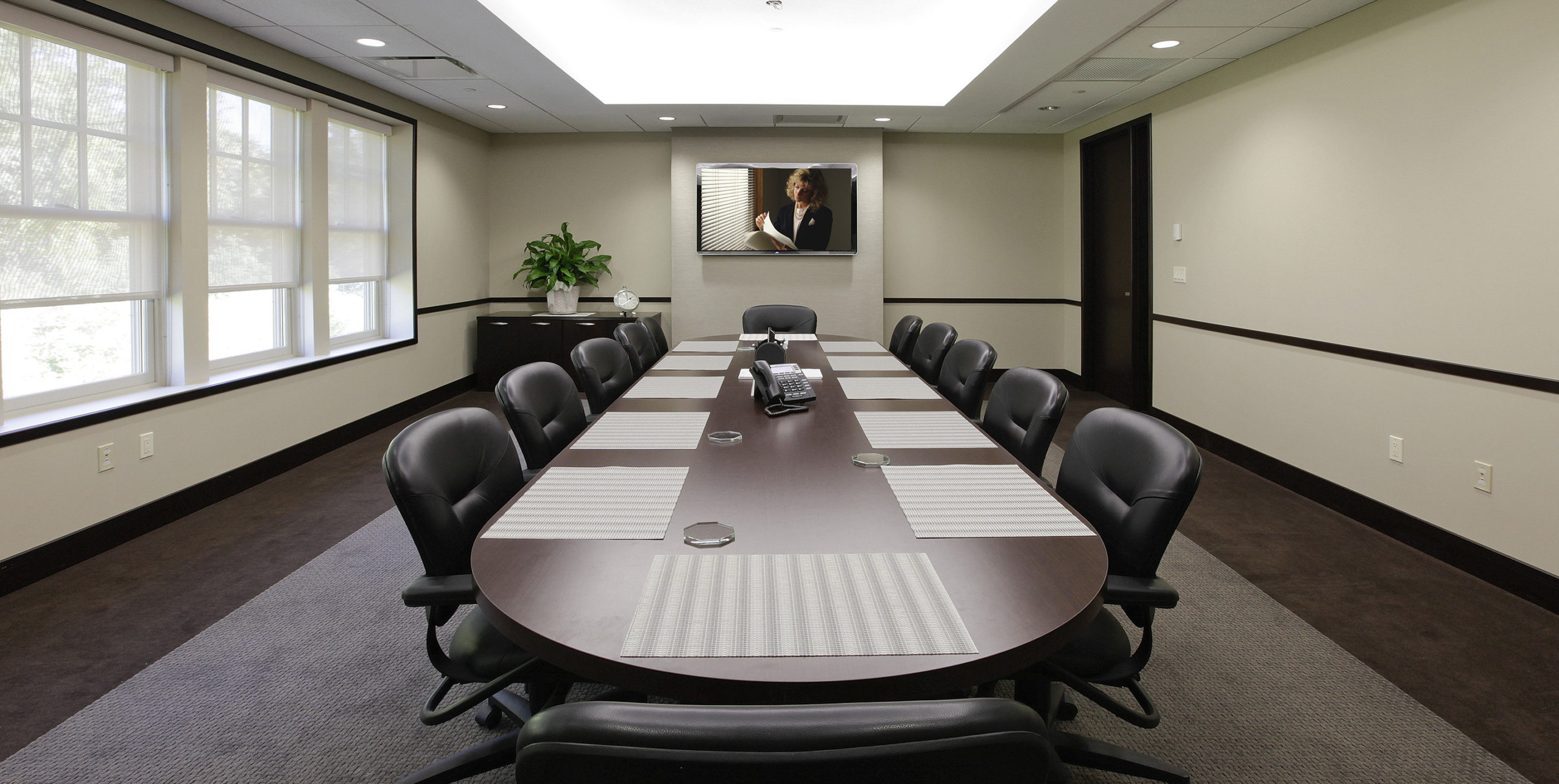 Conference room with a table and 12 chairs at Stafford Associates