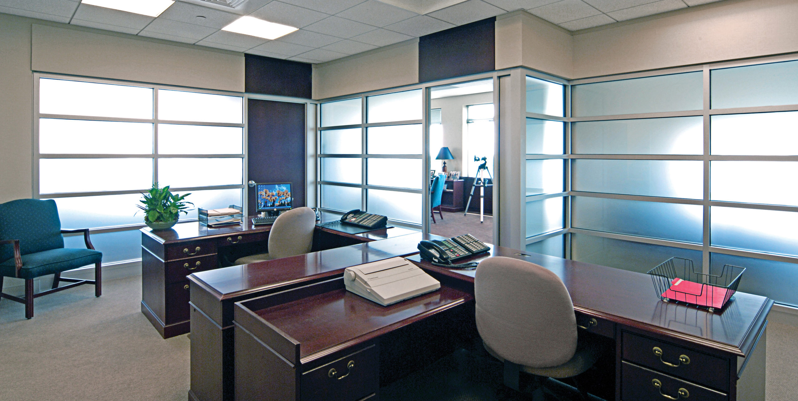 Two desks inside an office of Westbury Partners at 100 Motor Parkway, Hauppauge