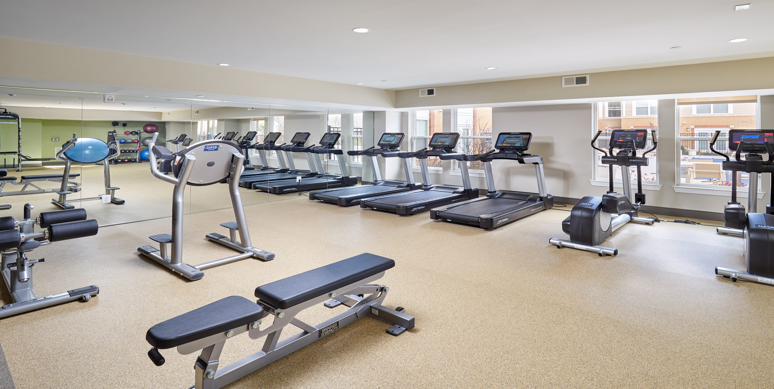 Treadmills, ellipticals, and other gym equipment inside the fitness center at The Jameson in Kincora, Virginia