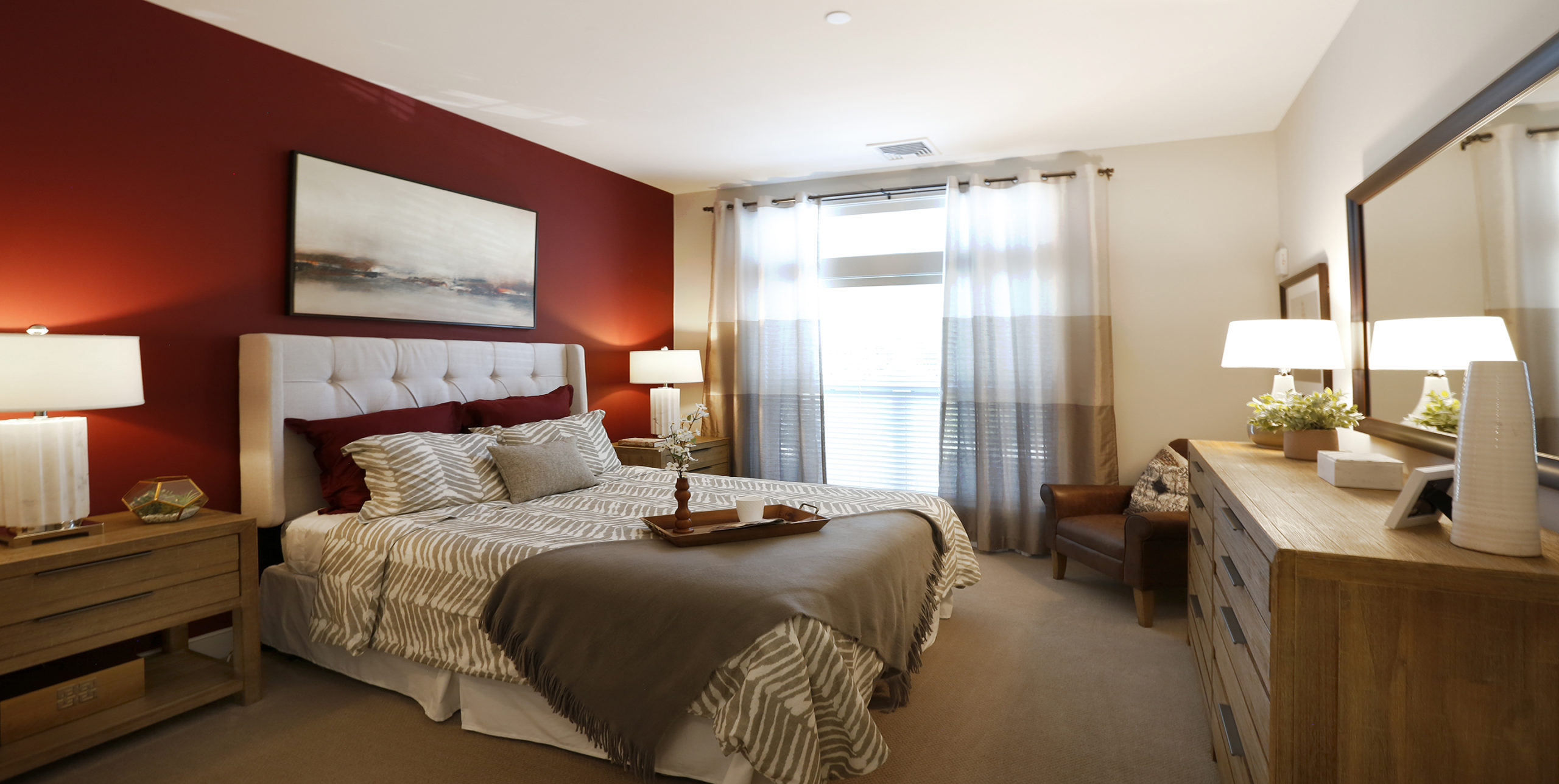 Queen-sized bed in a bedroom at Brightview Senior Living in Sayville, NY