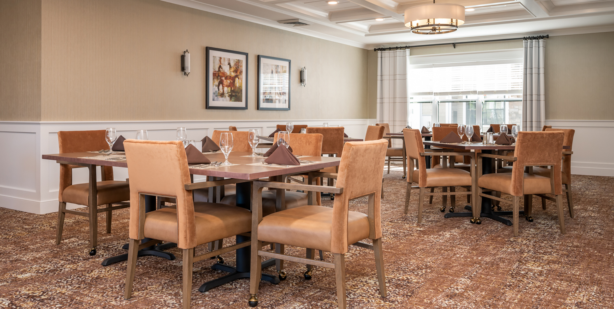Common dining room area with seating at Brightview Senior Living Port Jeff