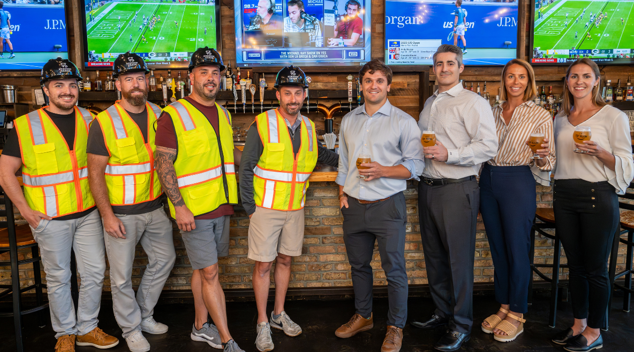 The TRITEC and Tap Room team celebrating the new lease at Station Yards