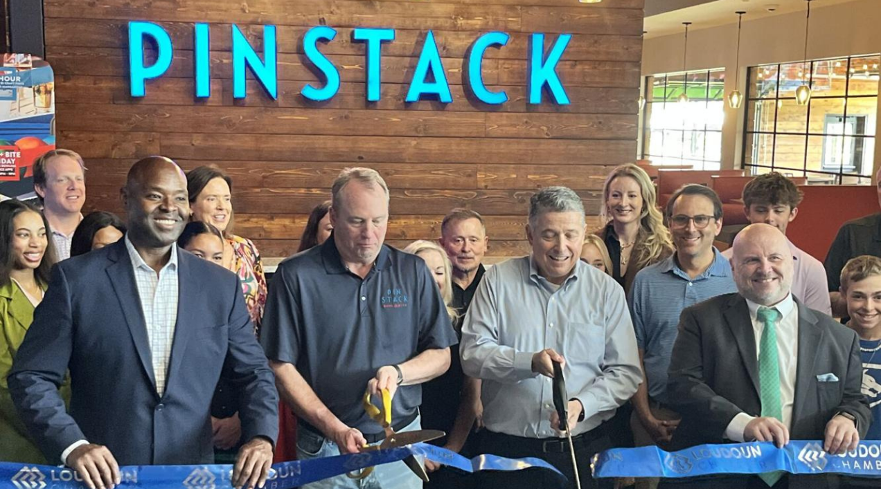 Ribbon cutting at PINSTACK in Kincora