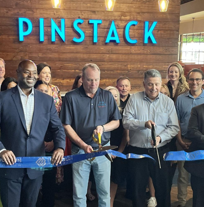 Ribbon cutting at PINSTACK in Kincora